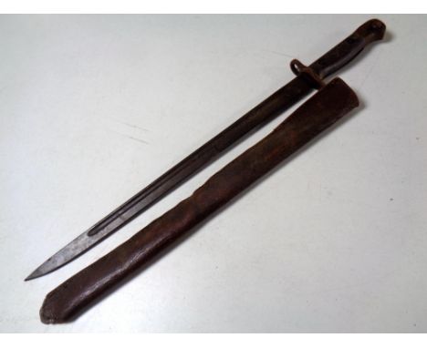 A British bayonet dated 1907, in leather scabbard