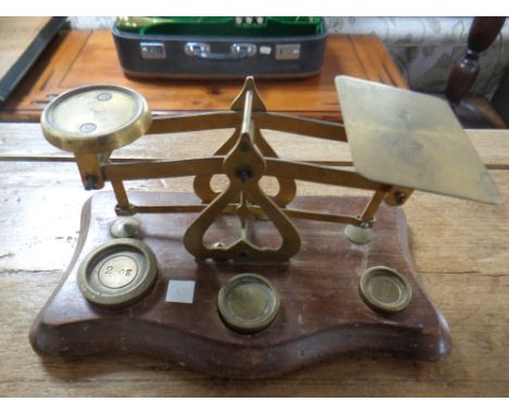 An antique set of postal scales with brass weights