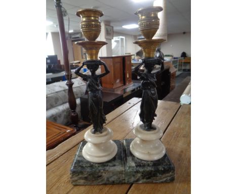 A pair of 19th century bronze, gilt brass and marble candlesticks modelled as women carrying urns (height 26cm)