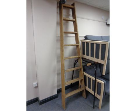 An early 20th century wooden step ladder