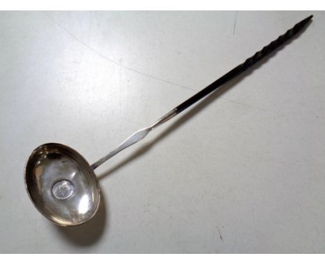 A 19th century silver toddy ladle inset with a coin