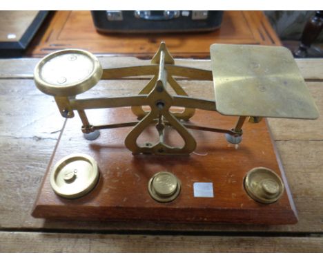 An antique set of postal scales with brass weights