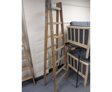 An early 20th century wooden step ladder