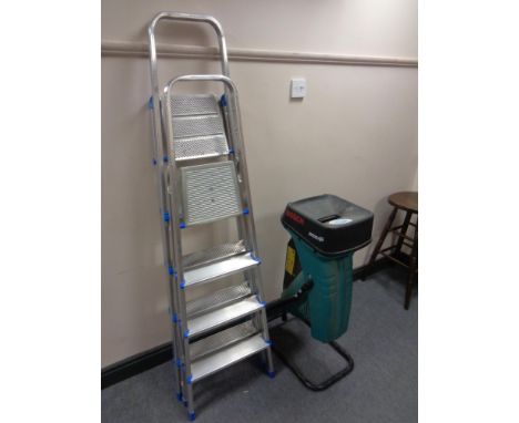 A Bosch garden shredder together with two folding aluminium step ladders 