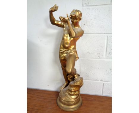 An antique gilt spelter lamp in the form of a man (height 78cm)