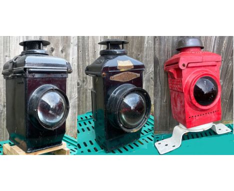 A trio of larger lamps comprising: a Lamp Manufacturing Crossing Gate Lamp with interior; a Adlake with interior and an Adlak