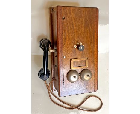 A large, wood cased Signal Box Telephone with bakelite handset in side cradle. Has a 4 position rotary switch in the centre a