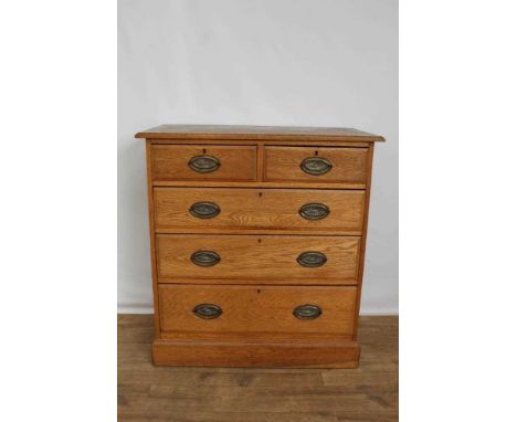 Late Victorian light oak chet of two short and three long drawers with oval brass handles, on plinth base, 92cm wide, 48cm de