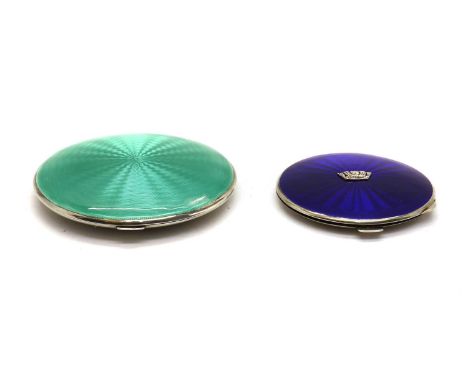 A silver and enamelled compact, by Adie Brothers, Birmingham, 1932, of circular form, 10cm diameterand a silver and blue enam