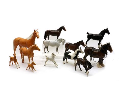 A collection of Beswick horses, to include a 'Champion Black Magic of Nork', a piebald gloss horse, model 1373, a large bay h