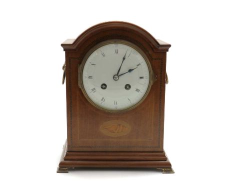 An Edwardian mahogany cased mantel clock,8-day French movement striking on a gong, the case inlaid with a conch shell to a ch