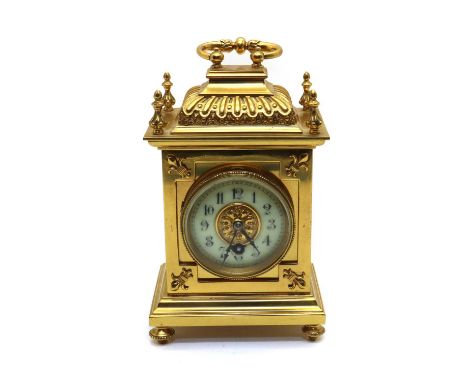 A brass carriage timepiece,early 20th century, the white enamel dial enclosing a single train movement, the case with fleur d