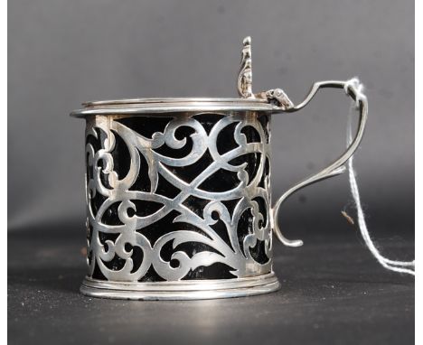 A Victorian silver hallmarked pierced mustard pot by Richards & Brown -Edward Charles Brown. Hallmarked for London 1868. The 