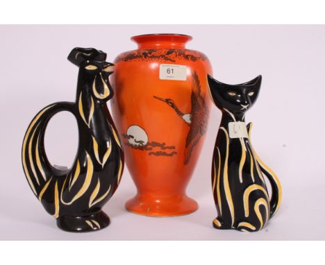 Two West German style black and yellow studio ceramic cats along with a retro Orange vase.  Measures: 29cms H vase.