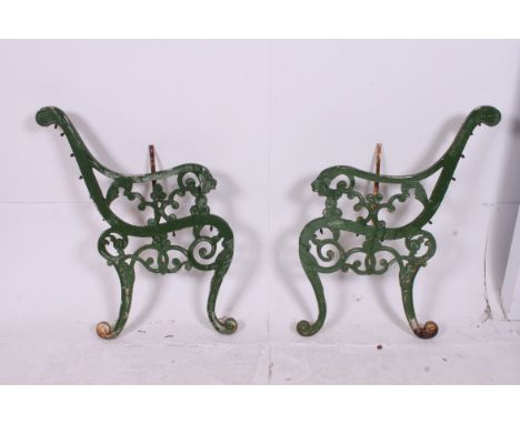 A set of vintage mid 20th century? / antique style cast metal Lion mask bench ends having green painted finish