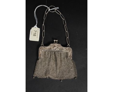 A white metal 925 silver ladies chain link purse with hallmarked silver hoop to handle.