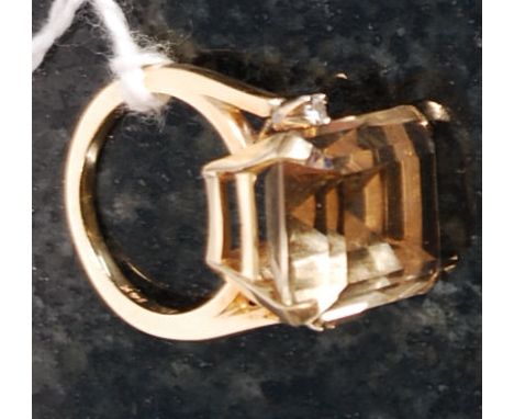 A 14k gold ladies large cushion cut topaz and diamond ring. The large topaz flanked by 2 diamonds approx 2pts each. Stamped 1