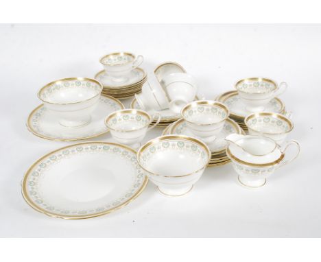 An early 20th century Shelley china part tea service comprising 12 saucers,12 plates, 8 cups, 2 cake plates, 2 bowls and a mi