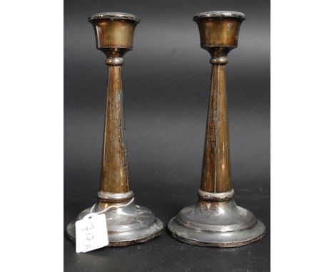 A pair of Edwardian silver hallmarked candlesticks being hallmarked for Birmingham 1901. Total Gross weight 614.4g 