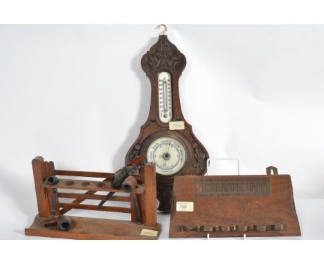 2 vintage pipe smokers stands, one in the form of a gate together with a barometer etc