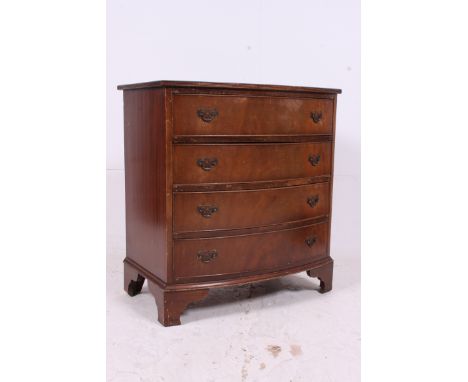 A Georgian style mahogany bow front chest of drawers. Raised on bracket feet having 2 short drawers over deep drawers beneath