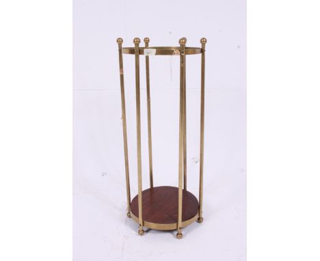A contemporary antique style brass umbrella stand having brass tubular uprights with finial top. Measures: 78cms H.