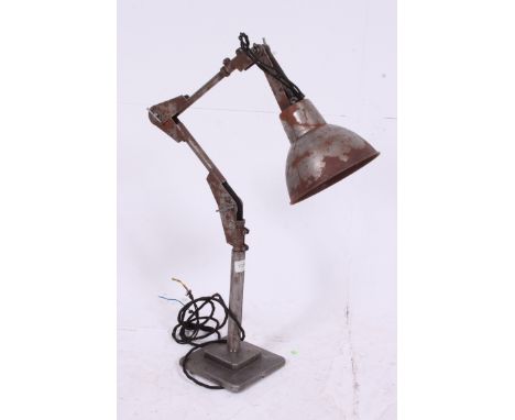 A good early 20th century Industrial anglepoise lamp of stainless steel construction having solid angled arm with pendant sha