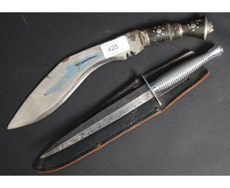 A faux Rogers hunting SAS knife having double edge blade together with a Kukrie knife.