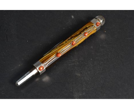 An unusual Chinese silver and agate mineral stone pointed pen. The silver collars surround a polished stone agate centre