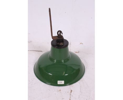 A 1930's / early 20th century Industrial pendant light shade in green with white interior having original fitments. Measures:
