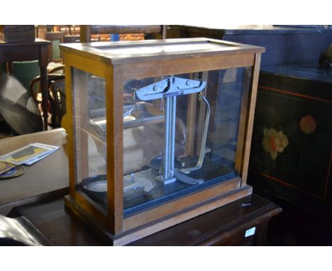A vintage set of cased weighing scales by Griffin & Tatlock, in original glass case, notation to sales.