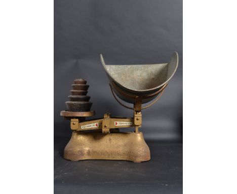 A large pair of vintage 1950's Industrial grocers scales by Avery constructed of cast metal with oversized bowls