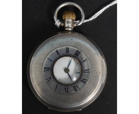 An early 20th century silver half hunter pocket watch, Birmingham 1929, maker Aaron Lufkin Dennison. Black  enamel dial with 