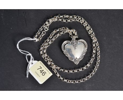 A silver 925 large ladies heart shaped pendant mounted to a large 925 silver chain. The verso of the pendant stamped Towle Si