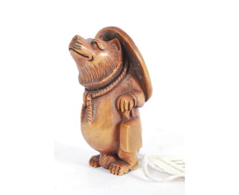 A Japanese oriental carved wood netsuke of a bear