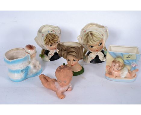 A collection of assorted 20th century ceramic vases in the form of children / babies, along with one rubber child in similar 