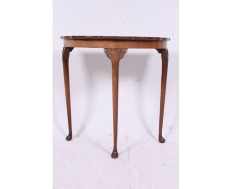 A 1930's Georgian style demi lune console hall table raised on cabriole legs together with a beech wood standard lamp and sha