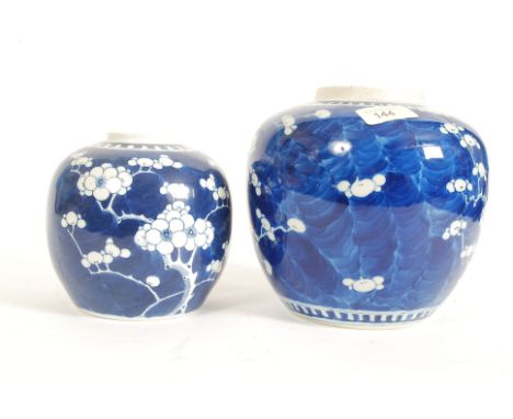 2 19th century Kang-xi Chinese ceramic baluster vases of blue and white form, one with character marks to base, the other wit