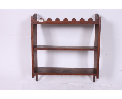 A Victorian country oak wall shelf having twin shelves with gallery surround atop. Measures: 74cms x 65cms x 23cms.