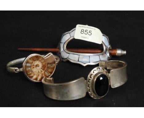 A 925 white metal silver ladies hat pin, along with a fossil inset bracelet (white metal) and another.