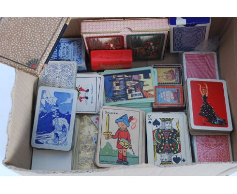 A quantity of assorted vintage playing cards to include novelty boxed sets and others. 
