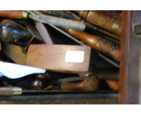 A box of tools to include assorted planes etc