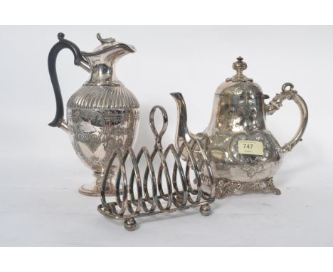 A 19th century Victorian silver plate teapot together with a similar rococo hot water jug and a large silver plate toast rack