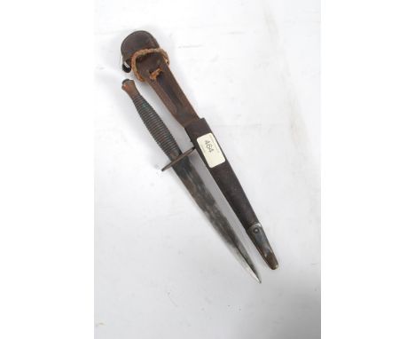 A 2nd world war copper handled commando knife in the manner of Rogers complete with leather scabbard - formerly property of e