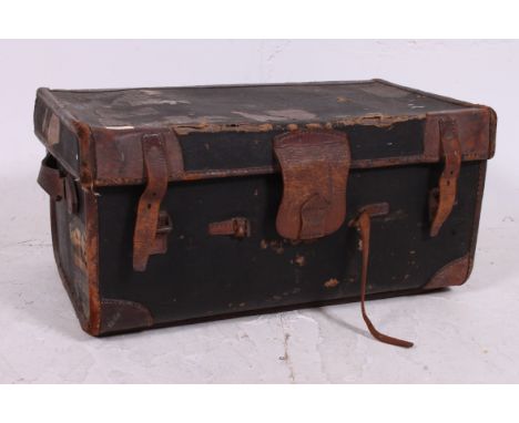 A good early 20th century leather suitcase steamer trunk complete with original shipping labels still applied. Measures:  33c