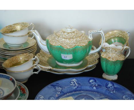 A 20th century Crescent George James & Co green and gilt tea service including teapot, cups, saucers etc.