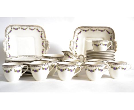 A Royal Doulton tea service having a good chintz foliate pattern  comprising cups, saucers, plates etc, pattern no E9996. Mea