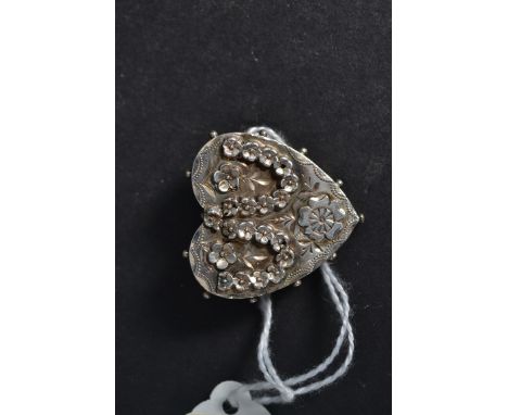 A Victorian Chester hallmarked 1886?  ladies silver heart brooch embellished with flower heads being chased decorated to the 