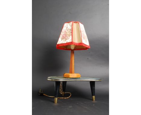 A retro three legged coffee table with a Venetian scene to top, along with an art deco lamp and shade. 