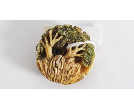 A 20th century Japanese netsuke of a woodland scene